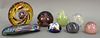 Eight art glass paper weights, three signed indistinctly.