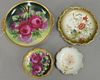 Group of porcelain hand painted flower plates to include a set of six Limoges France plates, five flower bread plates (dia. 9"), and...