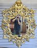 Gilt decorated pierced carved wood mirror. 55" x 42"