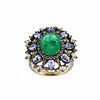 Ring with emerald and tanzanites.