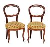 Pair of French Louis XV Style Carved Walnut Parlor Chairs, 19th c., the curved canted pierced back with a horizontal splat, to a bowed cushioned seat,