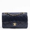Chanel Classic Double Flap Shoulder Bag, in navy blue quilted calf leather with gold hardware and interlaced chain, opening to a navy leather interior
