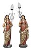 Pair of Large Polychromed Plaster Figural Torchere Lamps, 20th c., of robed women upholding a scrolled wrought iron shaft mounted with a light socket,