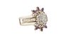 Lady's 14K White Gold Diamond Cluster Ring with seven round ten point diamonds, joined to a pair of ring guards, each mounted  with four tiny round di
