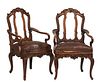 Pair of French Louis XV Style Carved Mahogany Fauteuils, early 20th c., the arched canted floral carved back with vertical splats, to curved arms, ove