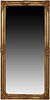 French Style Gilt Composition Overmantel Mirror, 20th/21st c., with a shell decorated frame with leaf decorated corners around a wide beveled plate, H