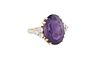 Lady's 14K Yellow Gold Dinner Ring, with a large oval app 5 ct. amethyst flanked by triangular lugs mounted with three ten point round diamonds, Size 