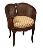 Carved Mahogany Louis XV Style Caned Bergere, 20th c., the caned back with caned wrap around sides, to a cushioned seat, on cabriole legs with toupie 