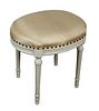Louis XVI Style Polychromed Walnut Oval Stool, 20th c., the cushioned top over a reeded skirt, on turned tapered reeded legs, in gold jacquard fabric 