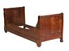 French Louis Philippe Carved Walnut Daybed, 19th c., the rolling pin sleigh ends joined by a curved front rail and a rectangular rear rail, H.- 31 1/2