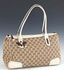 Gucci MM Princy Tote, in beige monogram canvas, with ivory leather and green and red web accents, and gold brass hardware, opening to a brown canvas i