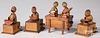 Four carved and painted wood animated Kobe figures