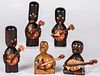 Five carved and painted strumming Kobe figures