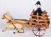 Bisque head figure in cart, with wind-up horse