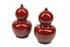 A pair of Chinese oxblood porcelain gourd vases