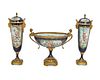A Sevres-style porcelain centerpiece and garniture urns