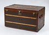 LOUIS VUITTON BRASS, LEATHER AND WOOD-MOUNTED TRUNK