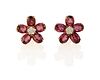 A pair of purple sapphire and diamond flower ear clips