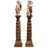 PAR DE AMORCILLOS SIGLO XIX Talla en madera policromada Incluyen columnas salomónicas Detalles de conservación. 141 cm Dim. Max.
