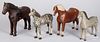 Four carved and painted horses, early/mid 20th c.