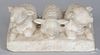 Carved marble lambs, 19th c., on a platform base