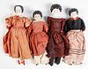 Four bisque head and shoulder dolls