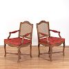 Pair Regence carved walnut open armchairs