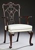 English Carved Mahogany Armchair, 20th c., the arc