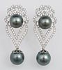 Pair of 14K White Gold Pierced Earrings, with an e