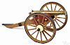 Brass barrel cannon and carriage with a 1'' bore, the carriage painted wood and iron