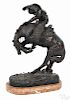 After Frederic Remington, bronze ''Bronc Buster'' sculpture with an oval marble base, 24 1/2'' h.