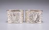 A PAIR OF EDWARDIAN SILVER NAPKIN RINGS