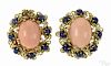 18K yellow gold, coral, and lapis clip earrings, each set with a central coral cabochon