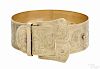 14K yellow gold belt form cuff bracelet, with buckle and engraved floral details, 8'' dia.