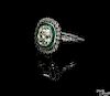 Platinum, emerald, and diamond ring, ca. 1920, with an Old Mine cut central, cushion shape