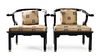 * Manner of James Mont, SECOND HALF 20TH CENTURY, a pair of yoke back armchairs with brass mounts