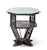 An Art Deco Style Wrought Iron Occasional Table, 20TH CENTURY, having an octagonal glass top on a quadripartite base