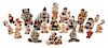 A Group of Twenty-Six Pottery Figures Height of tallest 1 3/4 inches.