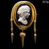 VICTORIAN HARDSTONE CAMEO TASSEL BROOCH, Set with a large hardstone carved cameo depicting the bust of a woman in profile. The surmount of part entwin