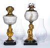 ASSORTED FIGURAL STEM KEROSENE STAND LAMPS, LOT OF TWO