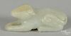 Chinese carved pale celadon jade recumbent animal figure, 3 7/8'' l.