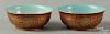 Pair of Chinese porcelain bowls, together with a bronze mirror, 2'' h., 5'' dia. and 5 1/4'' dia.