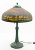 ATTRIBUTED TO HANDEL PATINATED METAL, PAINTED AND TEXTURED GLASS SHADE TABLE LAMP C 1900 H 21", DIA 14"