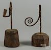 Two English wrought iron rush lights, 18th c., with wood bases, 11'' h. and 10 1/2'' h.
