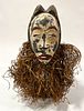 AFRICAN POLYCHROME TERRACOTTA WITH RAFIA MASK, H 13", W 8", D 3" 