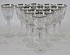 Set of 11 crystal wine glasses with silver rim