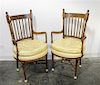A Pair of Fruitwood Open Arm Chairs Height 41 inches.