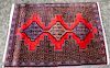 * A Small Persian Rug with Medallion Design 3 feet 4 inches x 2 feet 5 1/2 inches.