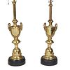 Pair of Brass Louis XVI Style Lamps, 20th c., of urn form with mask handles joined by garlands, on a knopped base on an ebonized plinth, H.- 22 in., D