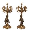 Pair of Gilt and Patinated Brass Louis XVI Style Putto Nine Light Candelabra, 20th c., each with a patinated musical putto standing in front of a flat